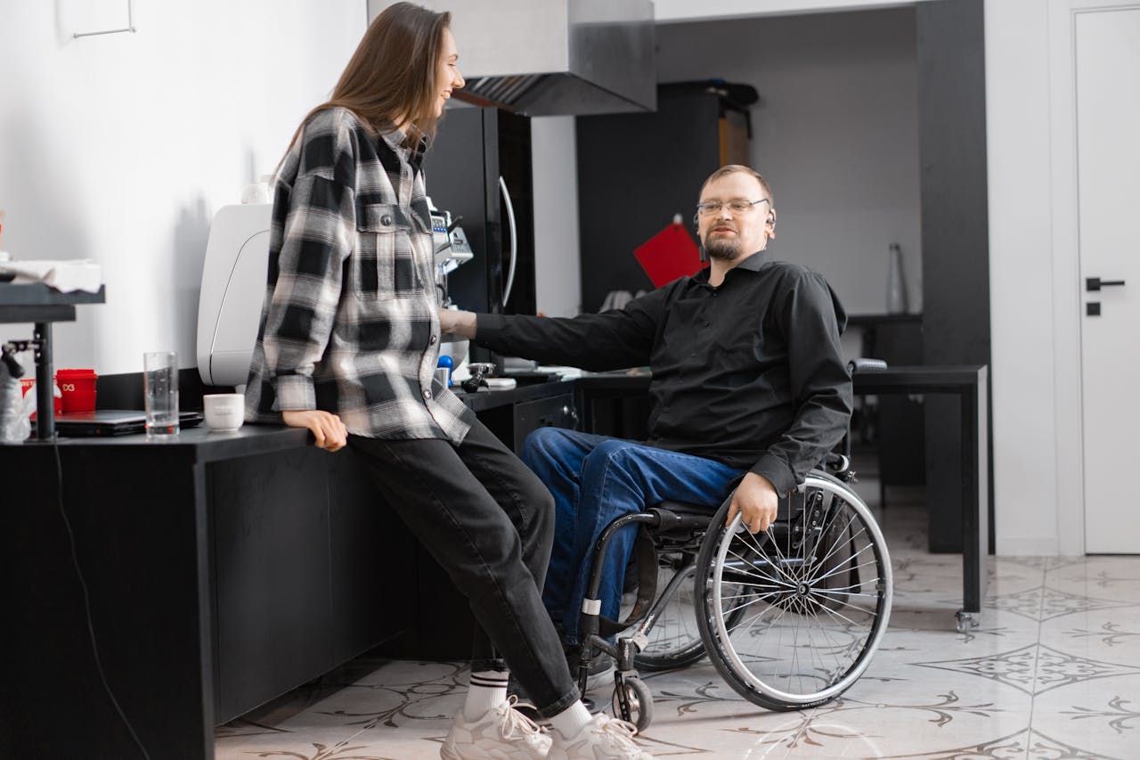 A Man in Black Long Sleeves Sitting on a Wheelchair